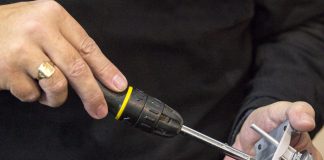 Image of man building De Agostini ModelSpace 1:8 Mustang GT500 scale model, as the cover image for a blog about how to kit bash scale models.